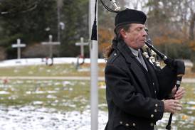 Photos: Flags placed on veterans' gravesites in Woodstock on Veterans Day