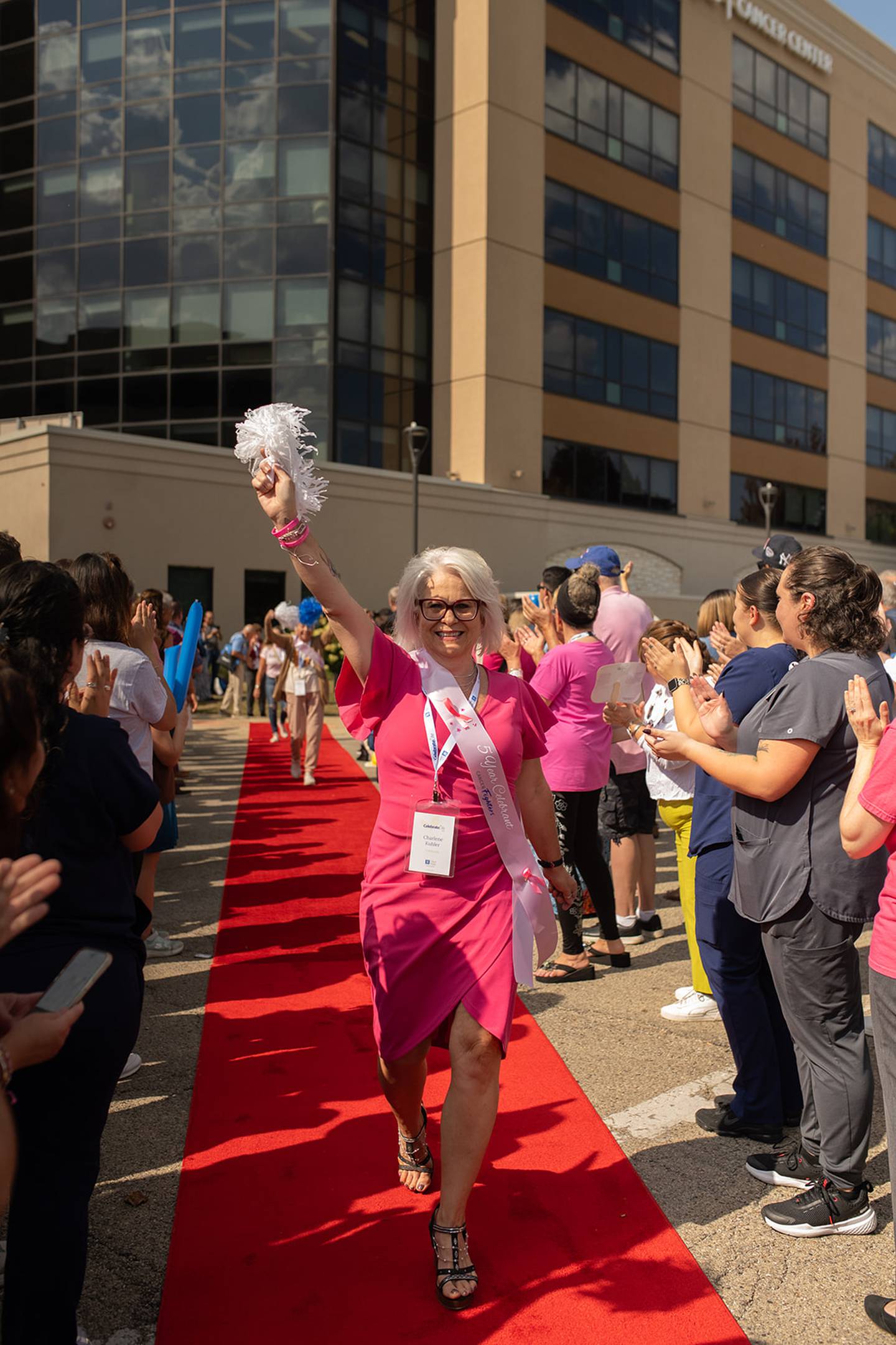 The event included a red-carpet walk, where each survivor was met with applause and cheers from family and friends, staff, and fellow survivors.