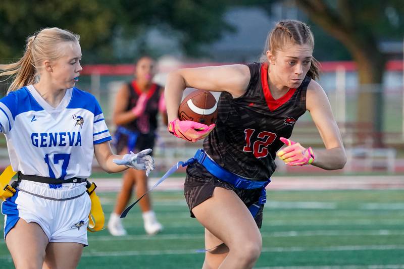 Yorkville's Annabel West (12) runs after the catch against Geneva’s Violet Warnke (17) during a non-conference game at Yorkville High School on Tuesday, Sept. 2, 2025.