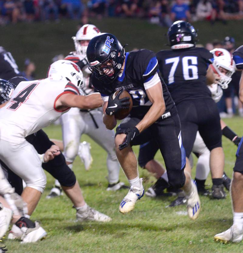 Eastland-Pearl City's Draven Zier (22) runs for a gain against Forreston during a Friday, Sept. 20, 2024 game in Pearl City.