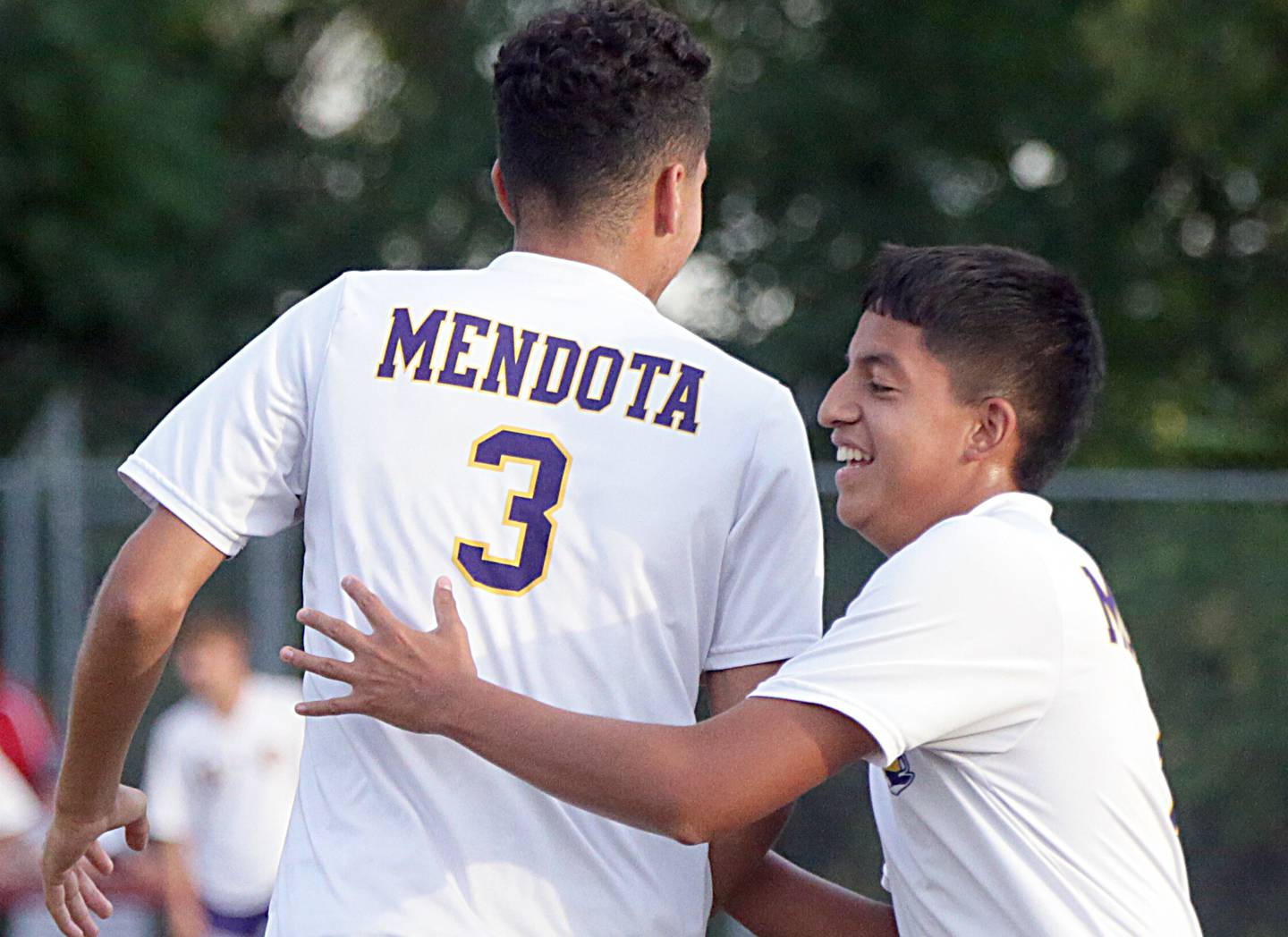 Mendota's Rafael Romero (3) gets a hug from teammate Issac Guzman after a Romero goal against Streator on Monday, Sept. 13, 2021.