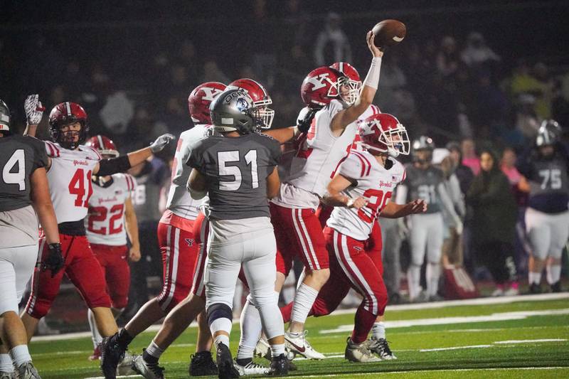 Yorkville's Jack Ferguson (12) celebrates after intercepting a pass against Oswego East during a football game at Yorkville High School on Friday, Oct. 13, 2023.