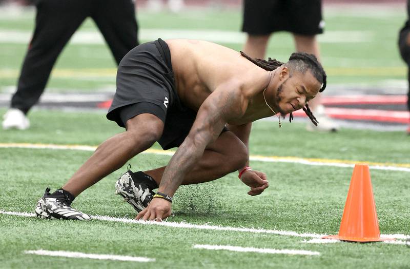 Former Northern Illinois University linebacker Lance DeVeaux Jr. does a drill Wednesday, March 30, 2022, during pro day in the Chessick Practice Center at NIU. Several NFL teams had scouts on hand to evaluate the players ahead of the upcoming draft.