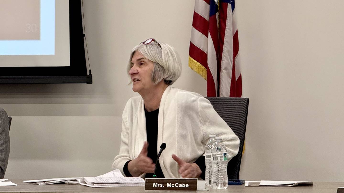 St. Charles District 303 School Board member Becky McCabe apologizes to parents of ACCESS program students who will be relocated beginning in the 2025-26 school year, during a School Board meeting on April 14, 2025.