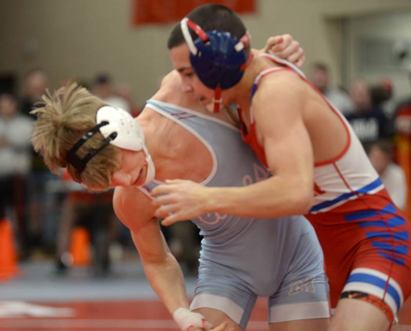 Woodstock Marian’s Brayden Teunissen (left) pulls away from Oregon’s Isaiah Perez and at 120 pounds at the 1A Oregon Sectional on Saturday, Feb. 15, 2025.