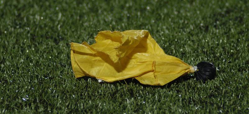 A referee's flag, one of many, lies on the field. The Lions of Urban Prep traveled to Sterling to take on the Warriors at Prescott Memorial Field at Roscoe Eades Stadium, September 5, 2025.