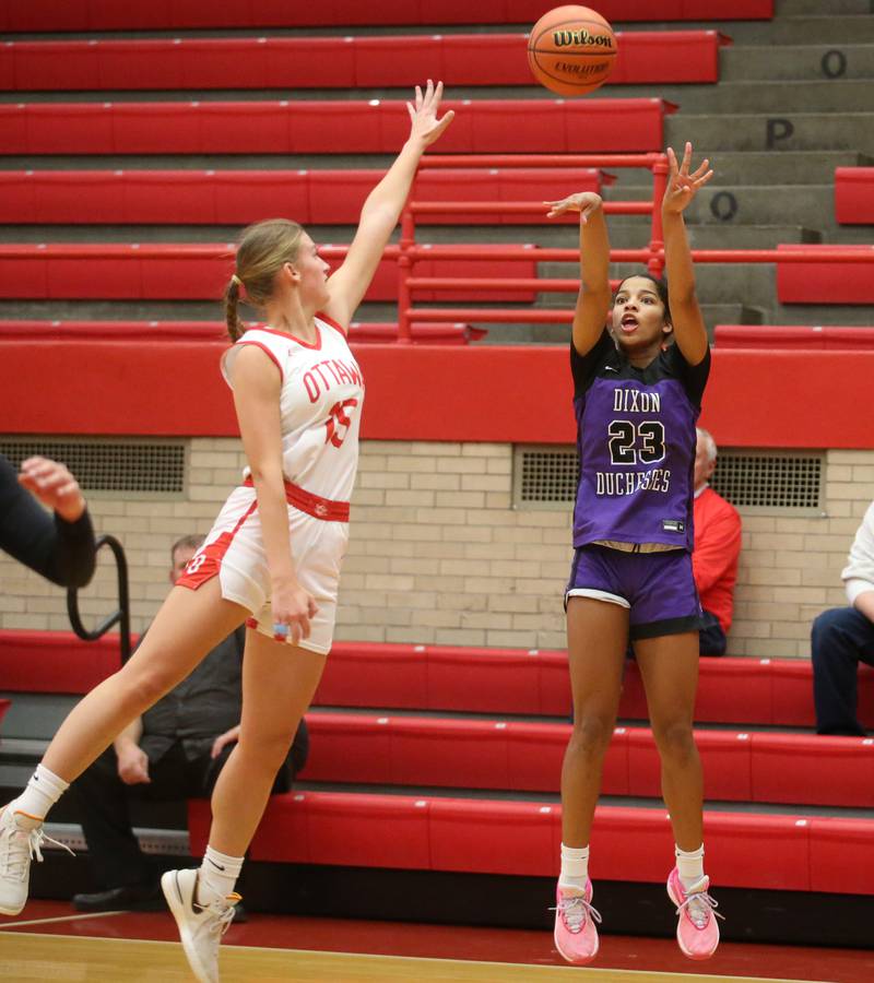 Dixon's Ahmyrie McGowan shoots a shot over Ottawa's Hailey Larsen on Wednesday, Nov. 29, 2023 at Kingman Gym.