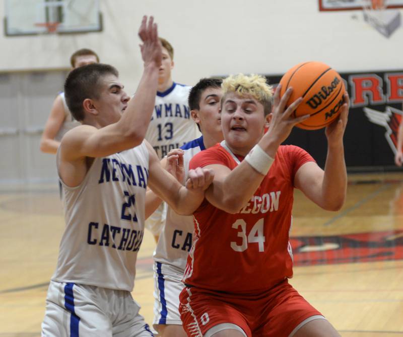 Oregon's Kade Girton (34) looks to shoot against Sterling Newman on Wednesday, Dec. 18, 2024 at the 63rd Annual Forreston Holiday Tournament.
