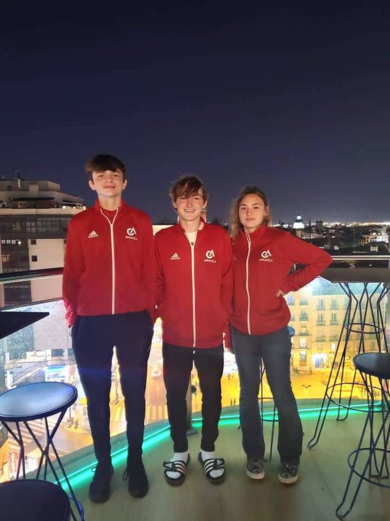 Aaron Henson, Noah Russow and Anna Russow pose on the rooftop of their parents' hotel in Madrid, Spain, in early April of 2022 in between games of their Avanza International Soccer Experience.