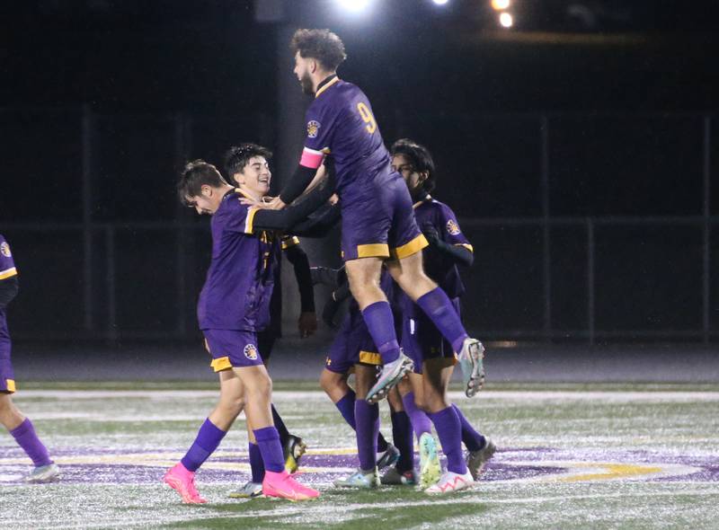 Mendota's David Casas leaps in the air while reacting with teammate Johan Cortes after scoring a goal during the Class 1A Regional game on Wednesday Oct. 18, 2023 at Mendota High School.