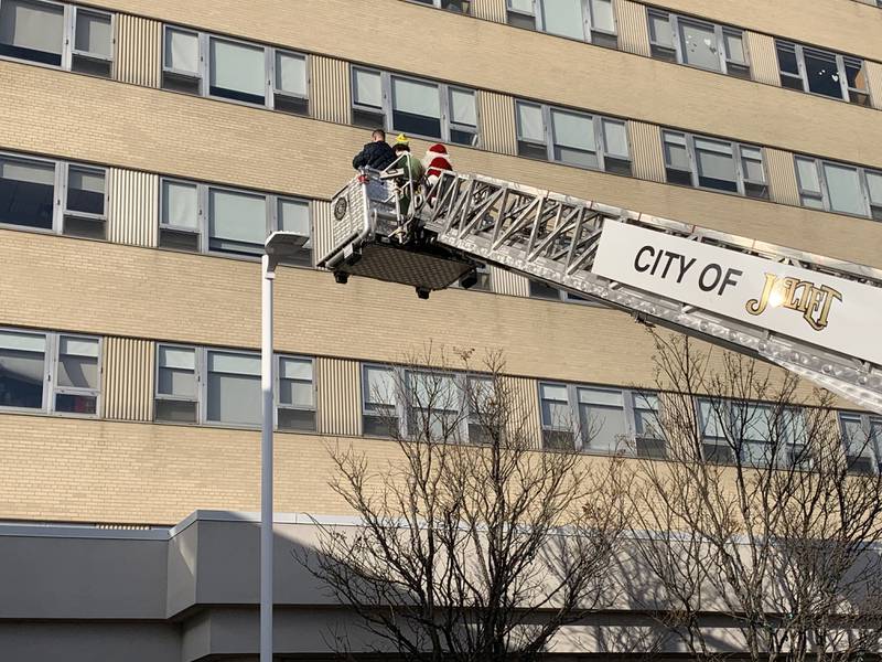 The Joliet Fire Department lifted Santa to different floors of AMITA Health Saint Joseph Medical Center in Joliet to wave to those who are in the hospital for the holidays.