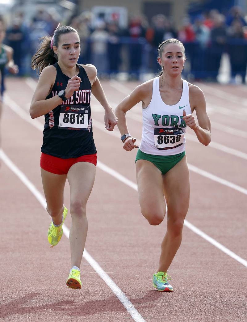 Maggie Quinn of York and Sofia Arcuri of Maine South during the IHSA Class 3A Lake Park cross country sectional  Saturday, Nov. 2, 2024 in Roselle.