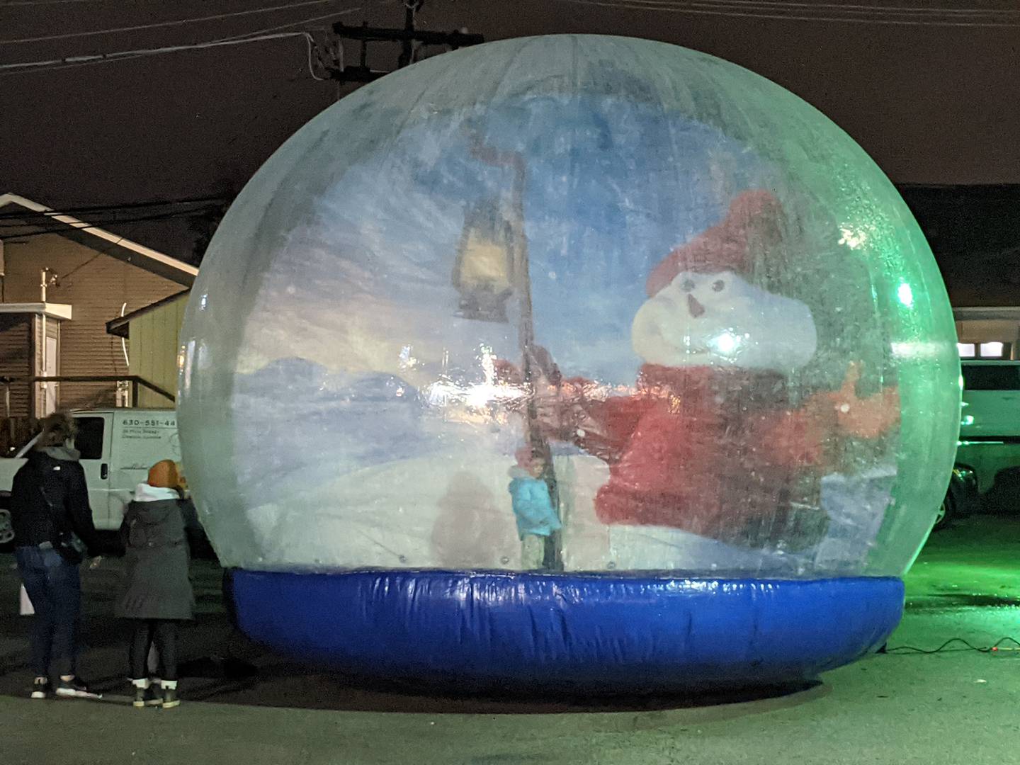 Children were able to go inside an inflatable globe as part of the Oswego Christmas Walk in downtown Oswego on Dec. 1.