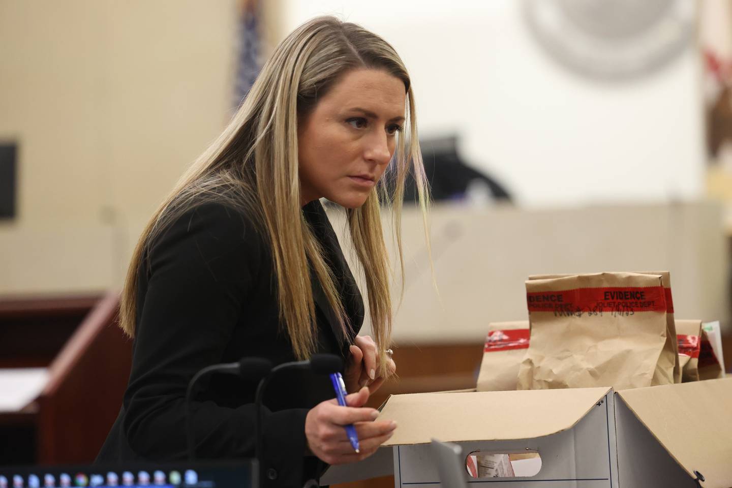 Will County Assistant State's Attorney Amanda Tasker talks a member of her team at the trial of Jermaine Mandley, 47, of Bolingbrook, at the Will County Courthouse on Thursday, Aug. 17, 2023 in Joliet. Mandley is on trial for the alleged shooting of Maya Smith, 24, in June 2022.