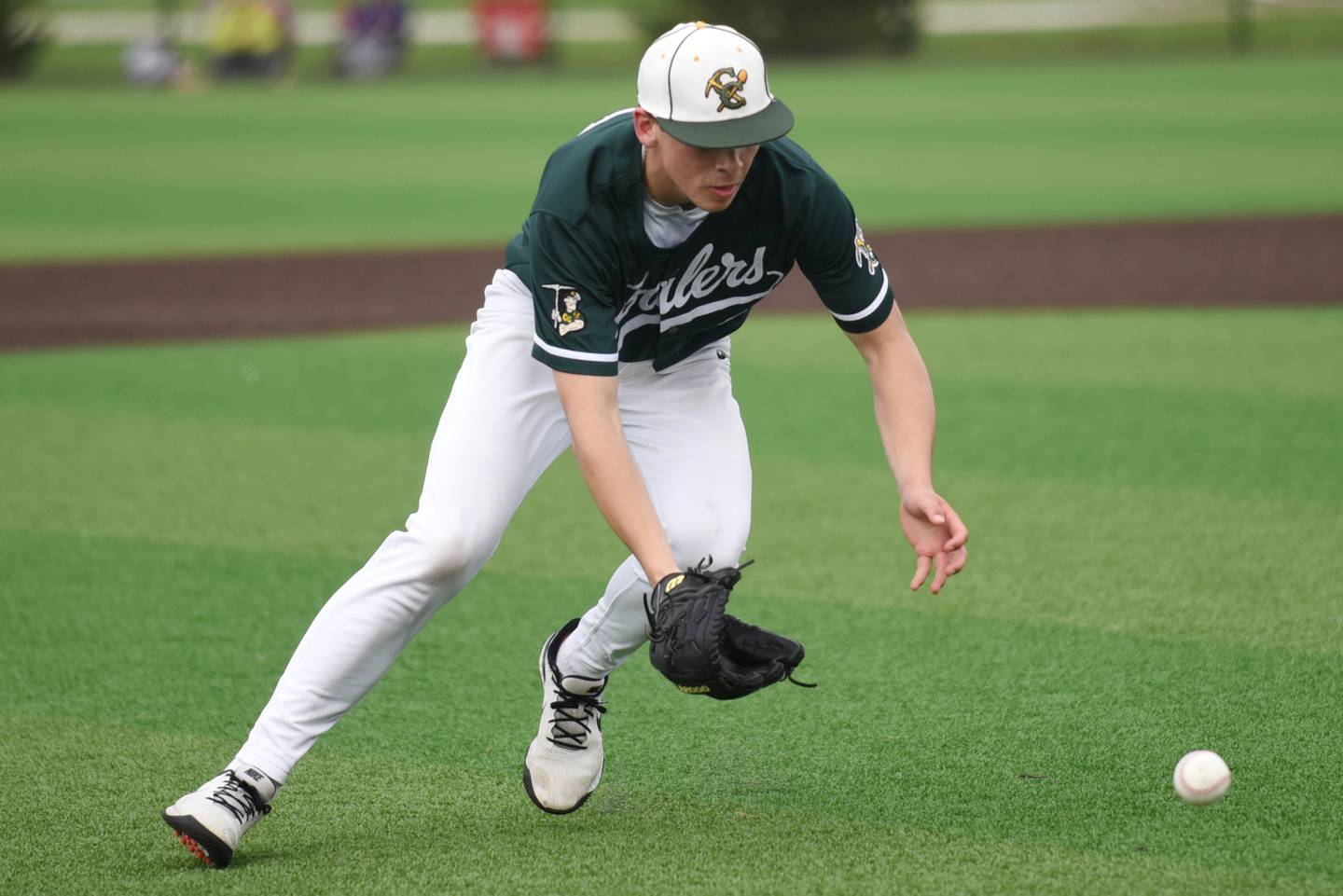 Coal City's Lance Cuddy fields a ground ball during a game against Wilmington at Coal City Wednesday, April 15, 2026.