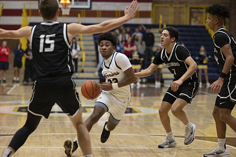 Sterling’s Kaedon Phillips handles the ball in the lane against Galesburg Friday, Jan. 5, 2024 at Sterling High School.