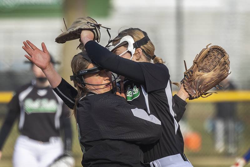 Rock Falls’ Kora Hosier (left) and Zoey Silva collide on a ball caught by Silva Thursday, March 27, 2025 against Princeton. Neither girl was injured.

Hands in photos are always important. The extension of the players’ arms and how the body positioning is nearly identical is pretty cool.