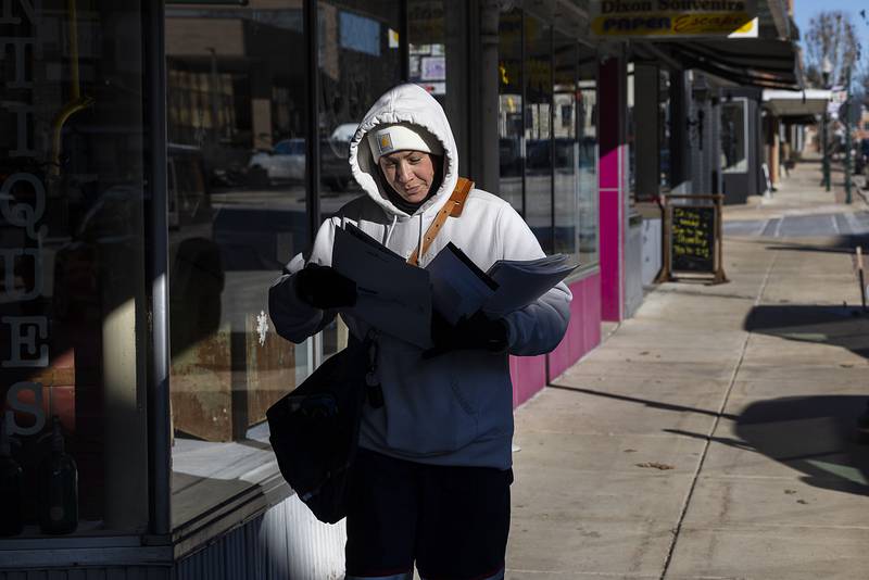 Mail carrier Jolanda Scott braves the cold and walks her route Tuesday, Jan. 21, 2025, in downtown Dixon. Falling temps and subzero wind chills on Tuesday made for the coldest day on this current cold snap.