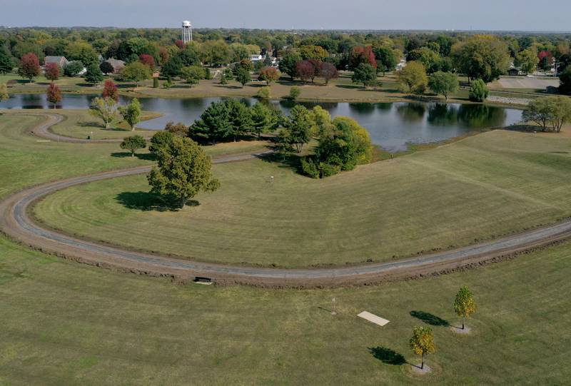 An aerial view of the walking path around Baker Lake on Monday, Oct. 13, 2025 in Peru. Crews are replacing the old walking path with a new one. The Peru City Council approved of the project last month. Gillan Construction out of Cherry was the winning bid to do the project for just under $300,000. The city will use a credit from Mertel Gravel of about $200,000 to pay for materials.

The resurfacing work will include a 10-foot wide concrete path with secondary concrete paths also added, connecting with the new parking lot near Lighted Way and connecting with the parking lot, playground, and shelter on the west side of Baker Lake. The park is closed to the public until early December.