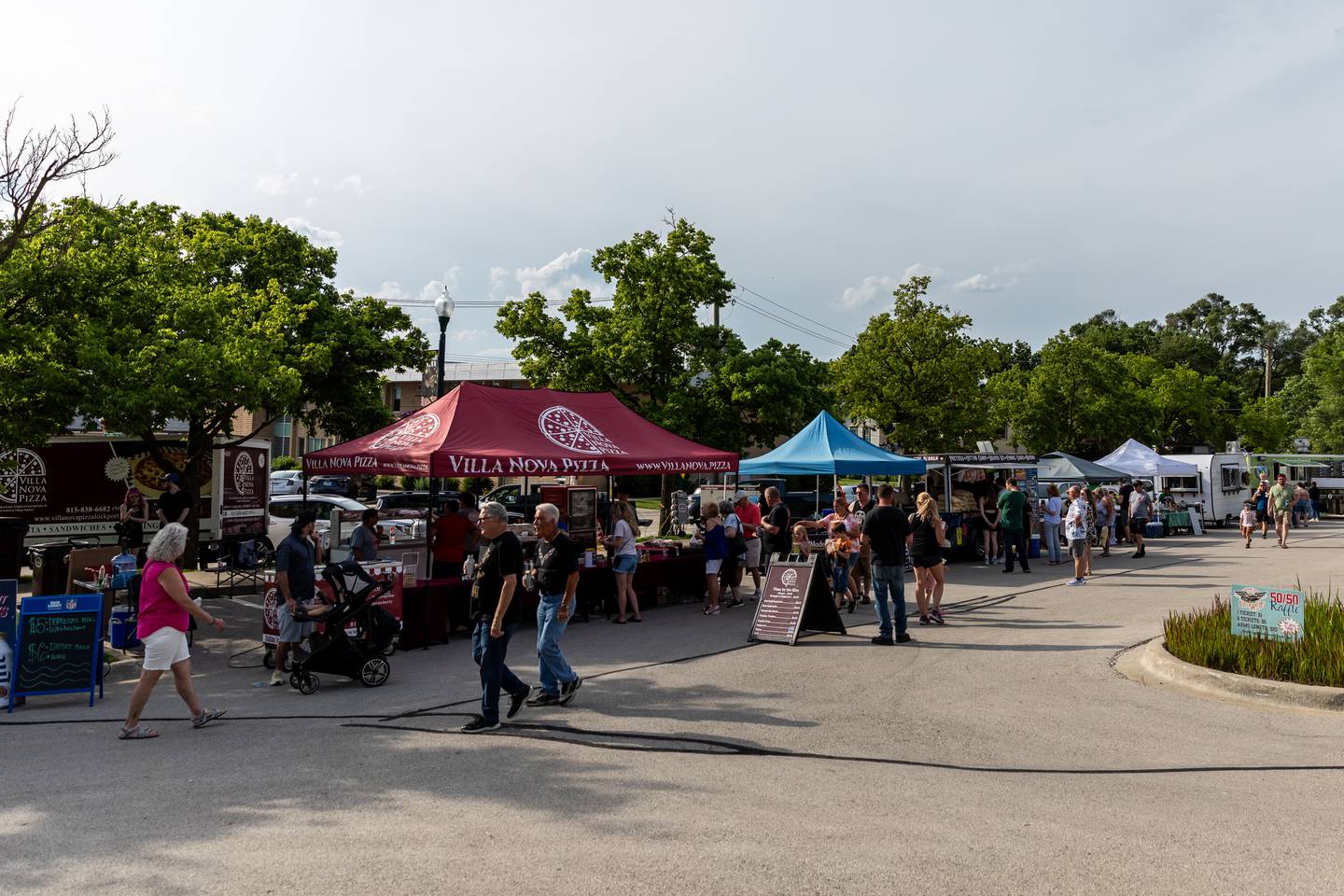 Cruisin' Into Lockport attendees enjoy refreshments from local businesses and food trucks during the June 3 event.