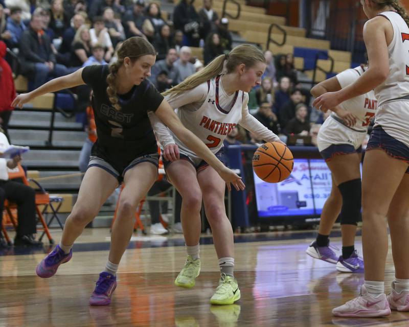 Oswego's Ashley Cook (2) grabs a loose ball during their basketball game between Oswego East at Oswego Friday, Jan 09, 2026 in Oswego.