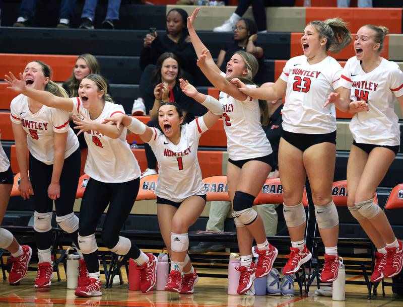 Huntley players celebrate after scoring the final point Monday, Nov. 11, 2024, during their Class 4A supersectional win over Fremd at DeKalb High School.