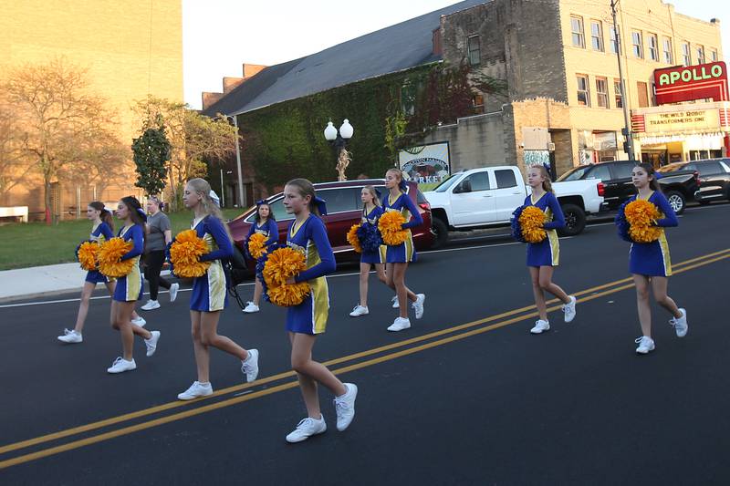 Logan Jr. High cheerleaders march in the Homecoming parade on Thursday, Oct. 3, 2024 downtown Princeton.