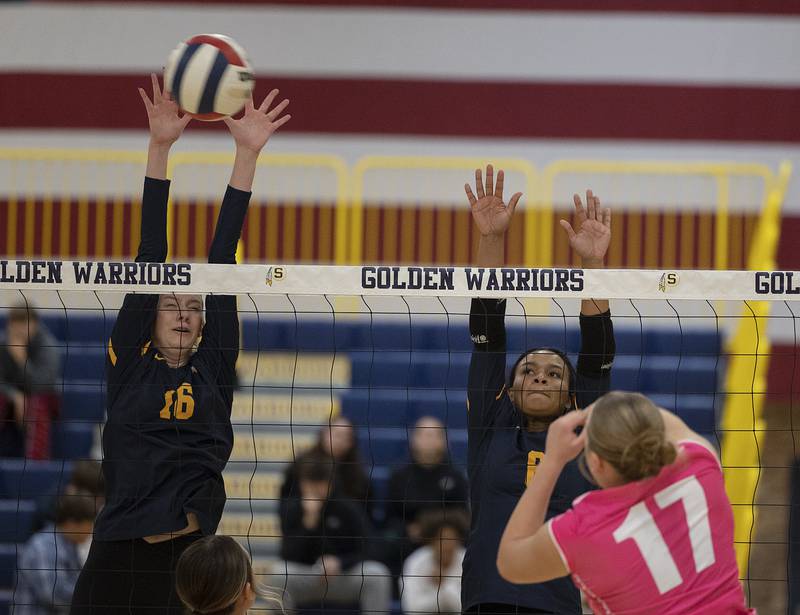 Sterling’s Kasey Weeks (left) and Alasia Harris Rascon goes up to block a shot against United Township’s Tiana Ludin Tuesday, Oct. 15, 2024, in Sterling.