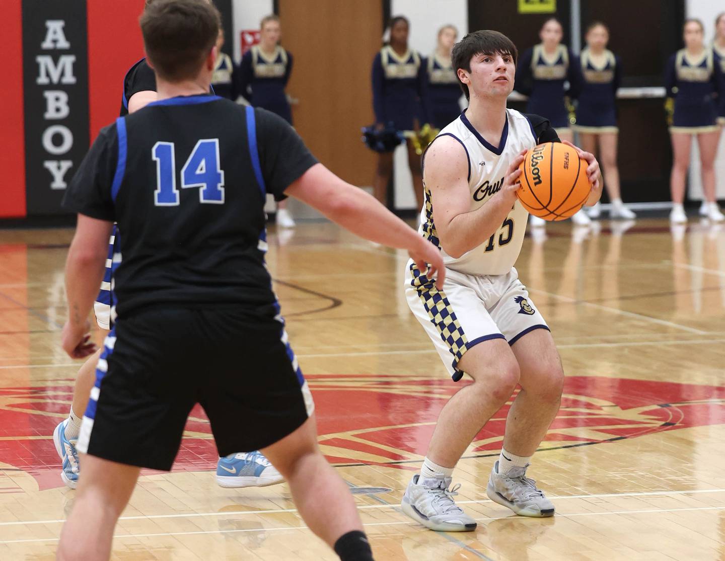 Marquette's Alec Novotney shoots a deep three-pointer in front of Hinckley-Big Rock's Austin Roop Tuesday, March 3, 2026, during their sectional semifinal matchup at Amboy High School.