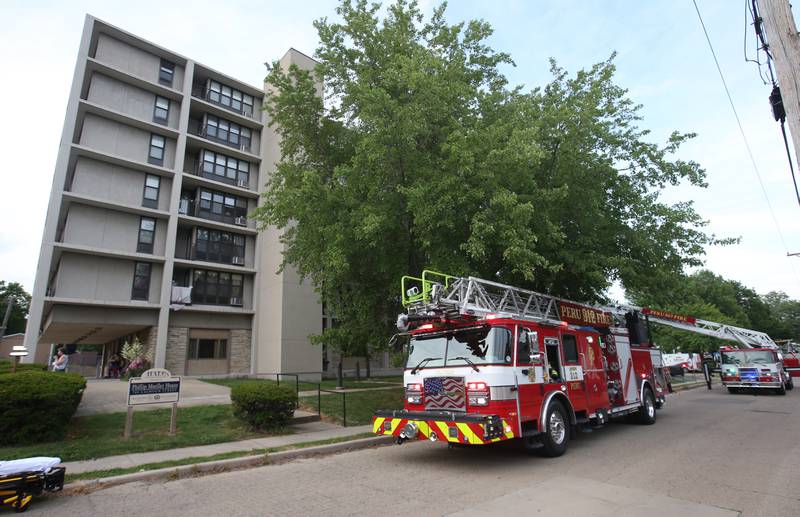 Peru firefighters respond to the scene of a fire at the Housing Authority for La Salle County (Peru Hi-Rise) on Tuesday, June 17, 2025 in Peru. The fire happened shortly after 6p.m.