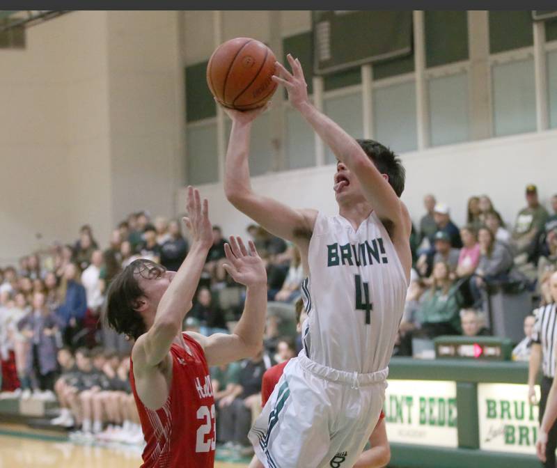 St. Bede's John Brady (right) runs in the lane to shoot a layup over Hall's Braden Curran (left) on Monday, Dec. 14, 2022 at St. Bede Academy.