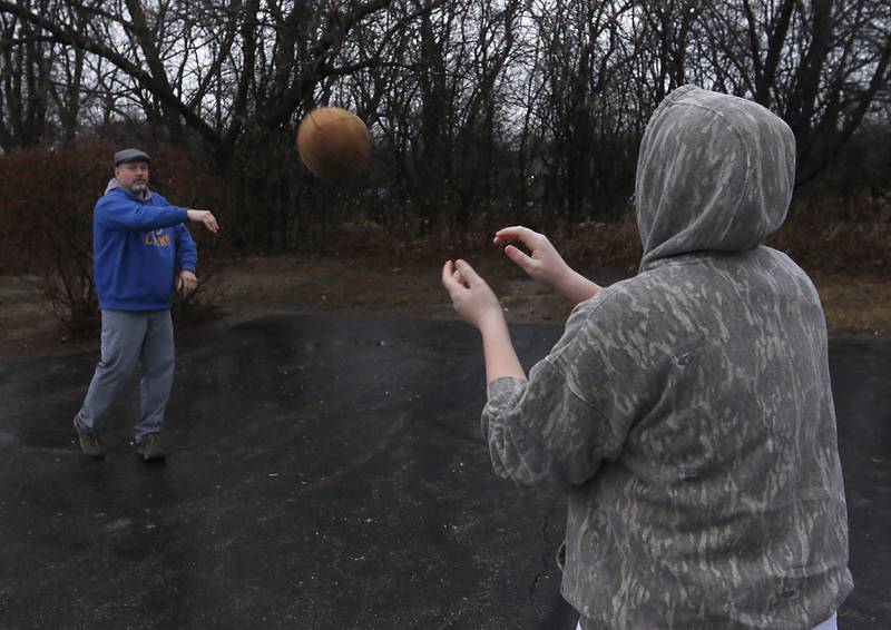 Big bother Dave toss a football around with his little brother, Chase, 13, on Thursday, Jan 20, 2023 in Crystal Lake as they hang out to gather. The two are are part of the Big Brothers Big Sisters of McHenry program.