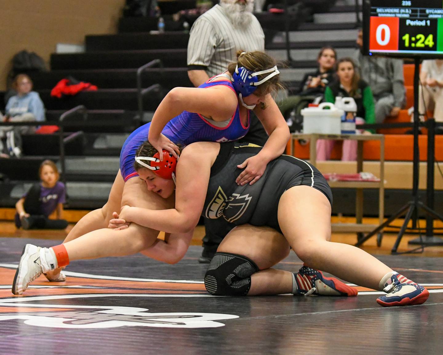 Sycamore’s wrestler, Jasmine Enriquez, right, tries to control Savannah Trevino of Belvidere High School during the 235-weight class 3rd place regional match up on Saturday Feb. 14, 2026, held at DeKalb High School.