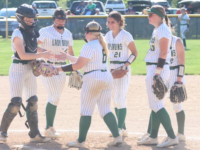 Members of the St. Bede softball team gather on the mound between innings on Friday, May 15, 2026 at St. Bede Academy.