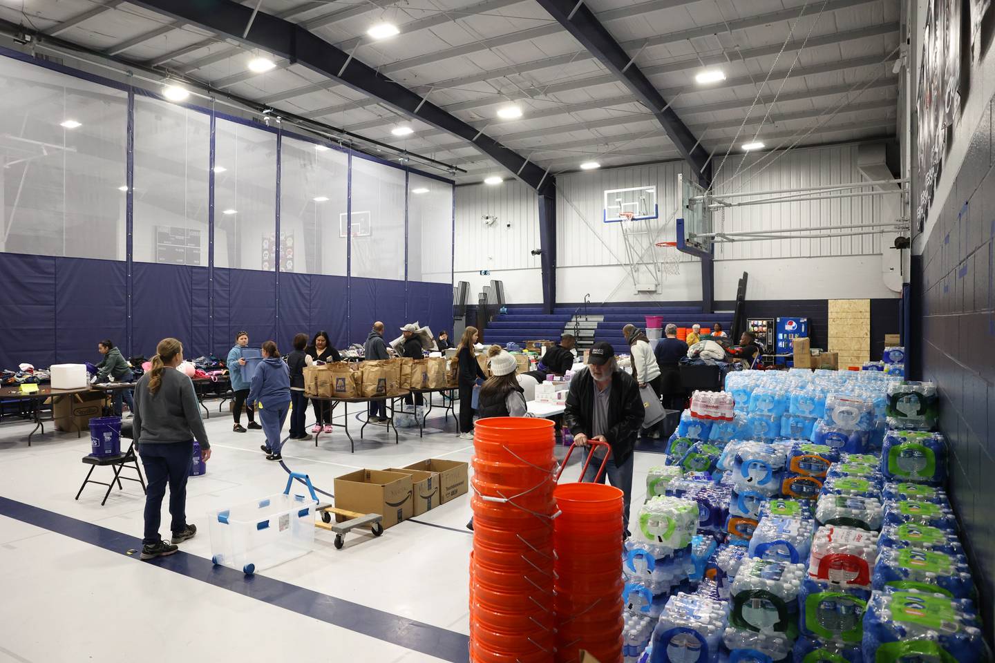 Supplies are organized for pickup at Grace Christian Academy on Thursday, March 12, 2026, following the EF-3 tornado that tore through Kankakee County on March 10. The school, which is on the outskirts of Aroma Township along Waldron Road, canceled classes in order to become a supply and meal hub for those impacted by the storm.