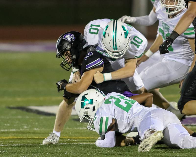 Downers Grove North's Downers Grove North's Oliver Thulin (10) is tackled by York's Charles Freed (10) during football game between York at Downers Grove North.  Sept 29, 2023.
