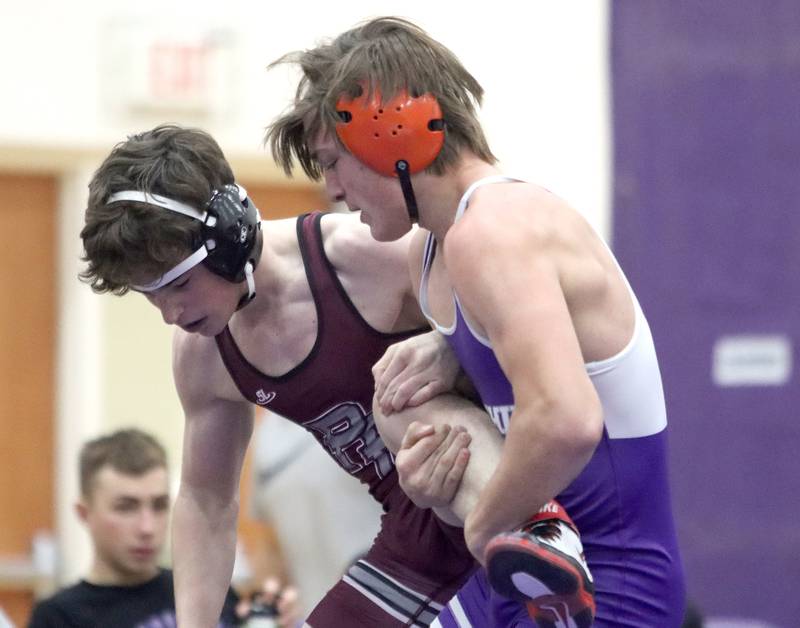 Hampshire’s Aric Abbott, right, battles Prairie Ridge’s Matt Moritz at 157 pounds in varsity wrestling on Thursday, Dec. 5, 2024 at Hampshire High School in Hampshire.