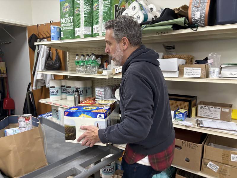 Woodstock Food Pantry volunteer Mark Schab processes a donation Oct. 31, 2025.