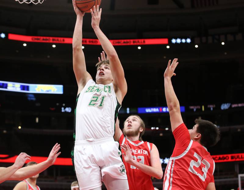 Seneca's Lane Provance eyes the hoop while running in the lane between Streator defenders Quinn Baker and Logan Aukland during a game on Tuesday, Dec. 21, 2023 at the United Center in Chicago.