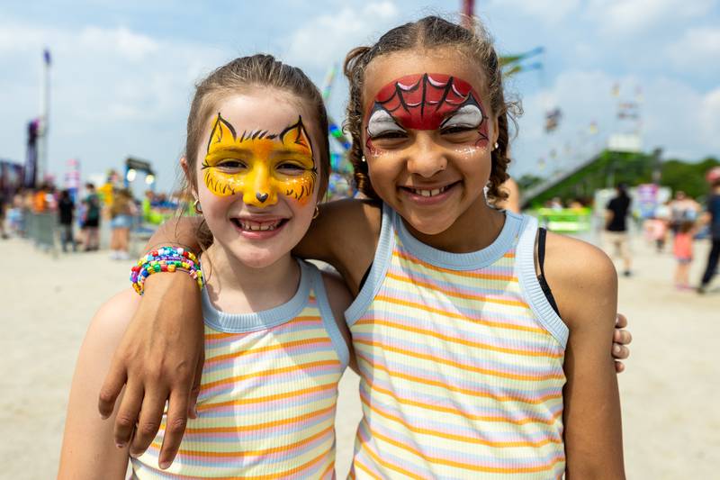 Joliet residents Sophia Noyd and Eva Ladson show-off their fun face-paint during Old Canal Days in Lockport on June, 7, 2025.