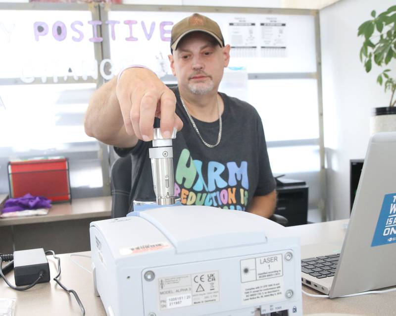 Matt Rowlee, director of outreach and drug technician at Perfectly Flawed uses a spectrometer used to identify both legal and illegal drugs and their components on Thursday, Oct. 16, 2025 at their office in La Salle.