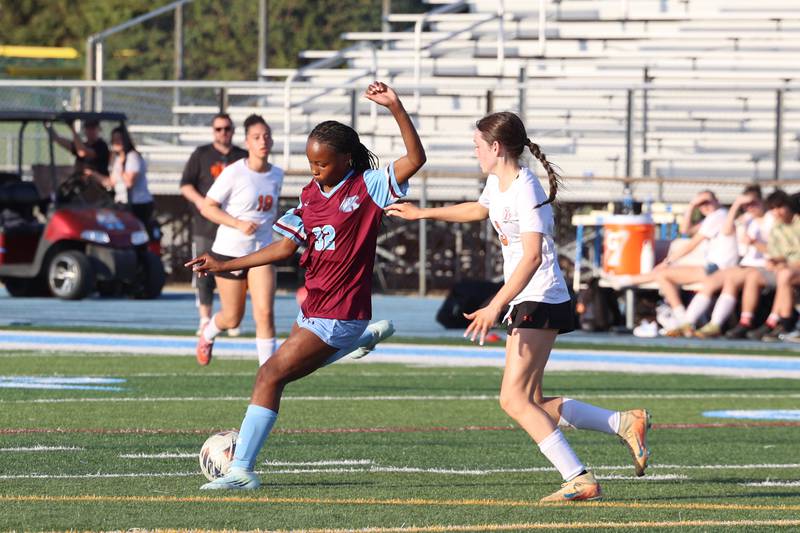 Kankakee's Alina Mkhwanazi maneuvers with the ball against Beecher's Molly Krupa during Kankakee's 8-4 victory over Beecher on Wednesday, April 22, 2026. Mkhwanazi tallied six goals for the Kays in their win in Southland Athletic Conference play.
