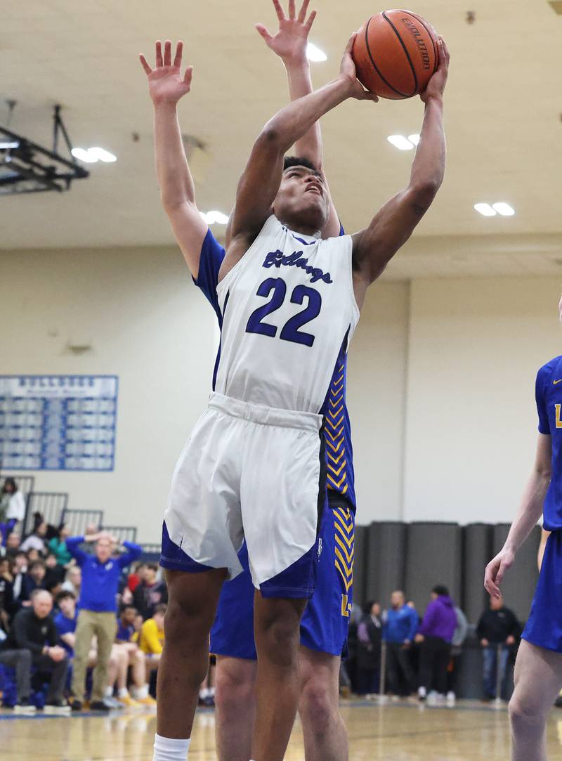 Riverside Brookfield’s Steven Brown (22) goes in for the basket against Lyons during a boys varsity basketball game on Friday, Jan. 26, 2024 in Riverside, IL.
