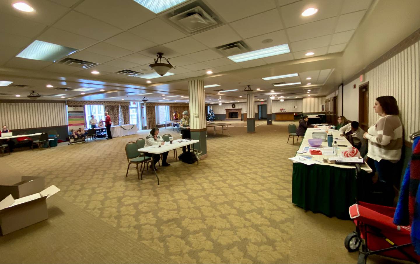 Multiple representatives from DeKalb area agencies, including the Family Service Agency of DeKalb County, DeKalb Township, City of DeKalb and the American Red Cross set up informational booths to greet residents at Red Roof Inn, 1212 W. Lincoln Highway, on Monday, Dec. 23, 2024, in DeKalb. Officials estimated about 60 residents were displaced from 32 units across a three-building apartment complex in the 1000 block of West Hillcrest Drive after a multi-level fire on Sunday, Dec. 22, 2024.