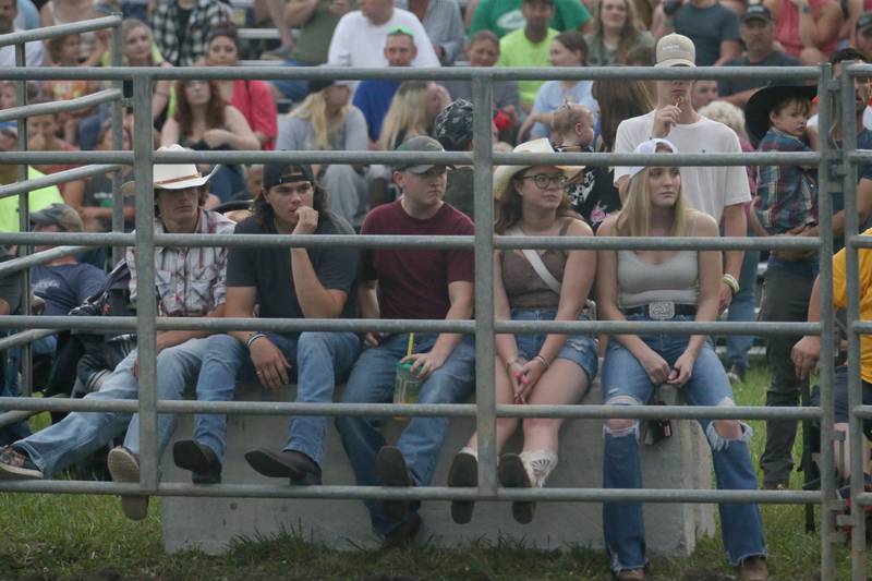 A group of people watch the Broken Horn Rodeo at the La Salle County 4-H Show and Junior Fair on Friday, July 14, 2023 in Ottawa.