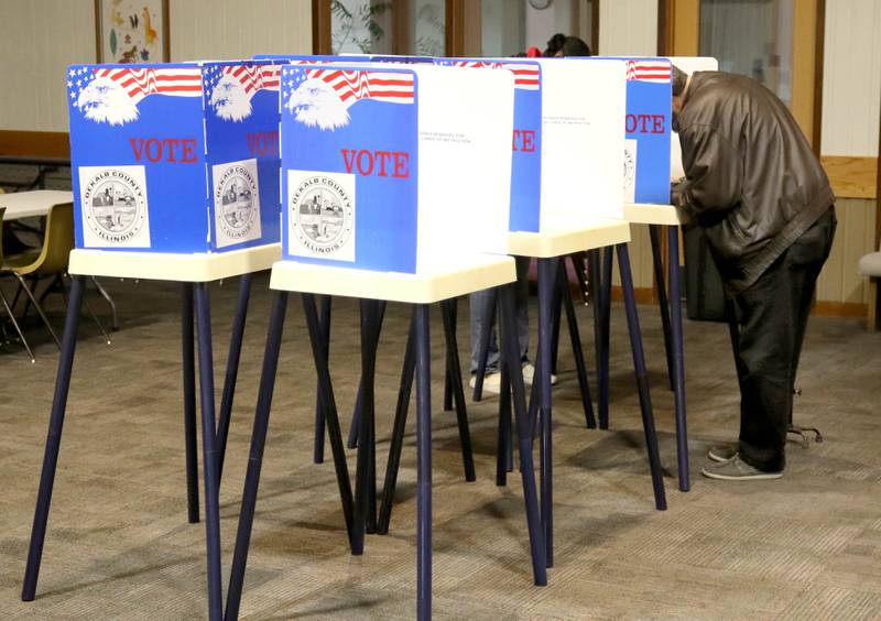 A voter casts his ballot on Election Day, Tuesday, Nov. 8, 2022, at the polling place in Westminster Presbyterian Church in DeKalb.