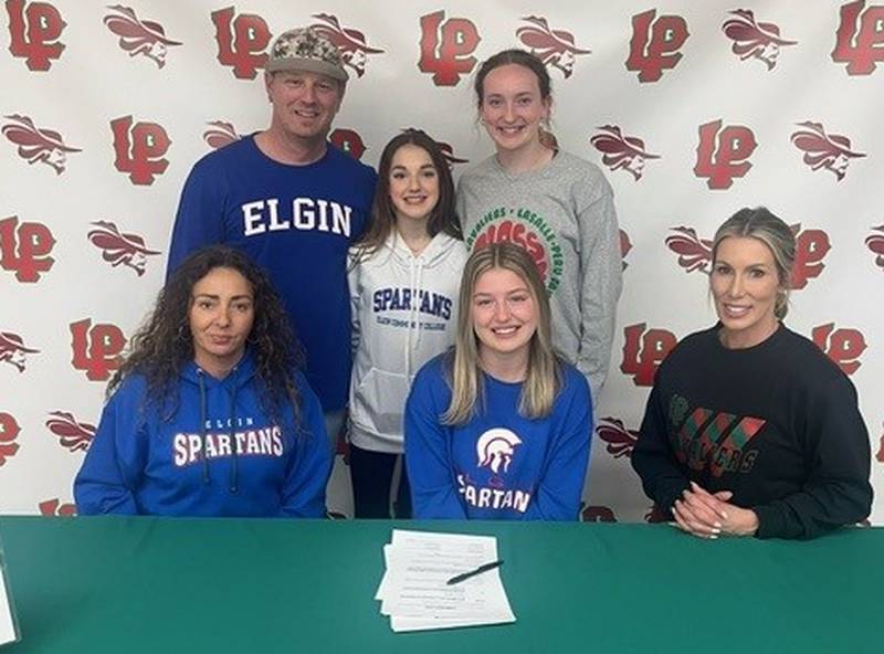 La Salle-Peru senior Veronica Hein (seated, center) signed to play soccer at Elgin Community College. She was joined by (seated, from left) her mother, Laura, and L-P coach Christin Pappas and (standing from left) her father, Chris, her sister, Natalia and her cousin and teammate, Katie Sowers.