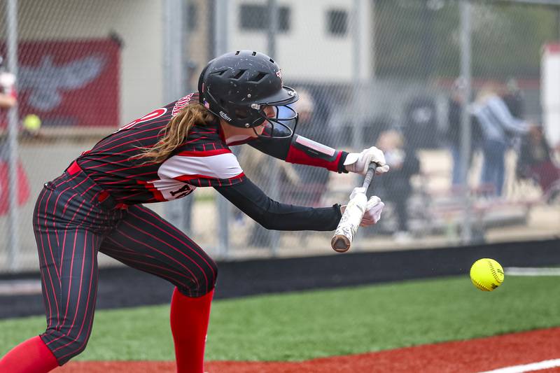 Yorkville's Hailey Sweeney (8) bunts during softball game between Joliet West at Yorkville on Wednesday, April 30, 2025 in Yorkville.