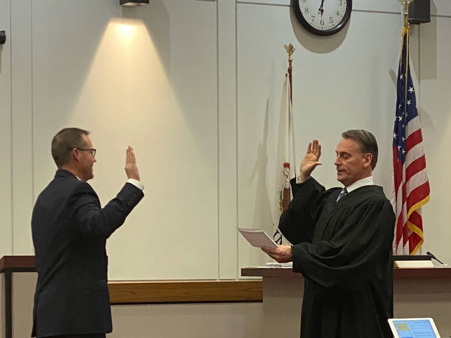 Judge Peterson administers the oath of office to Jerald White during Tuesday's county board meeting.