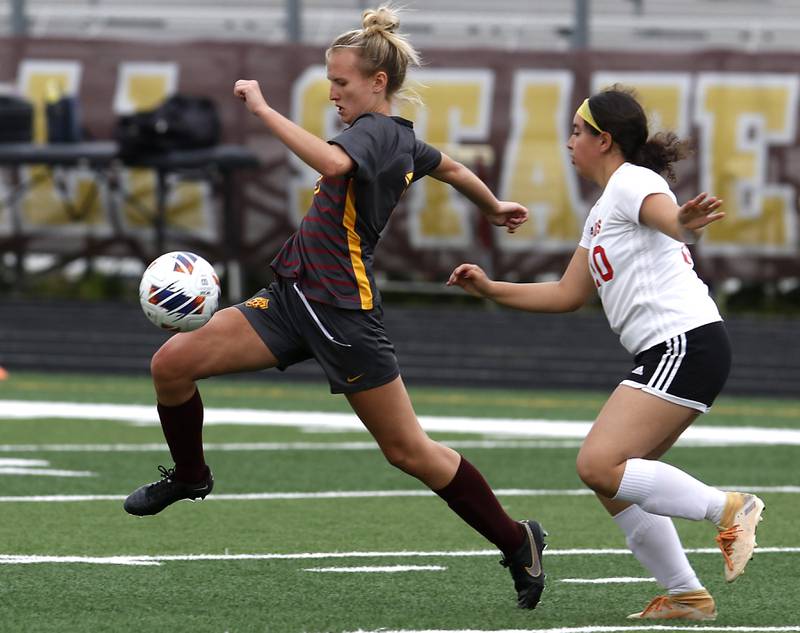 Richmond-Burton's Layne Frericks controls the ball in front of Woodlands Academy’s Giselle Vazquez during a IHSA Division 1 Richmond-Burton Sectional semifinal soccer match Tuesday, May 16, 2023, at Richmond-Burton High School.